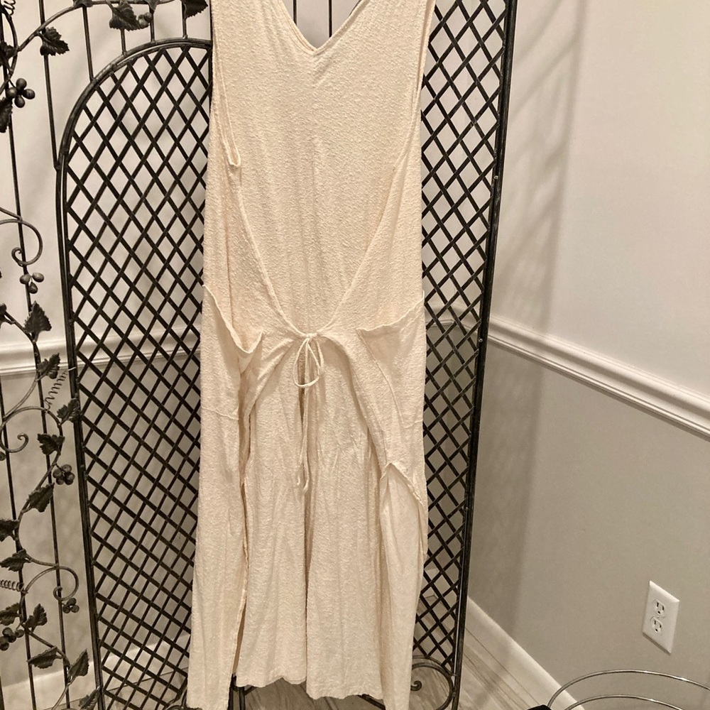 FP beach. Cream color jumpsuit wide leg tie front. Runs large. Great for summer